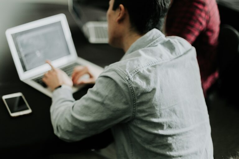 Person working with an AI coding assistant.