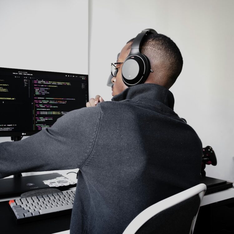 Person at computer figuring out which programming languages to learn for 2026.
